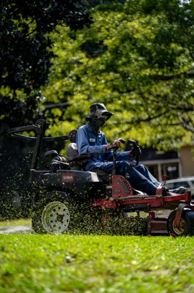 Lawn care crew mowing a property in New Windsor, NY
